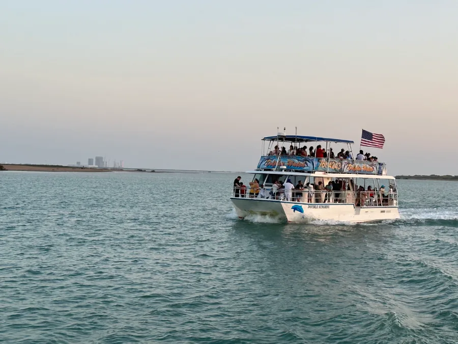 Guests watching a launch from the boat